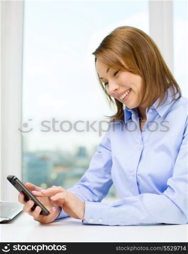education, business and technology concept - smiling businesswoman or student with laptop computer and smartphone