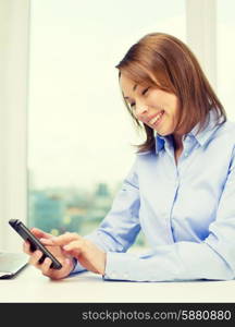 education, business and technology concept - smiling businesswoman or student with laptop computer and smartphone