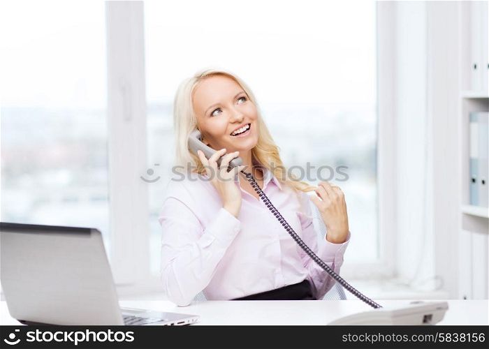 education, business, communication and technology concept - smiling businesswoman or student with laptop computer calling on phone in office