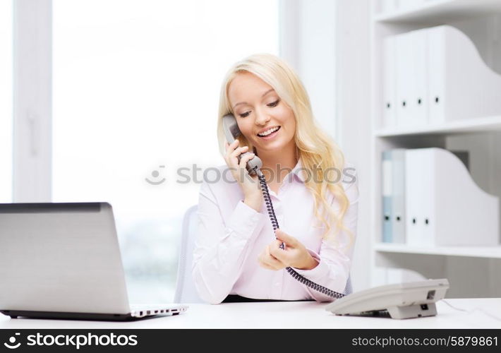 education, business, communication and technology concept - smiling businesswoman or student with laptop computer calling on phone in office