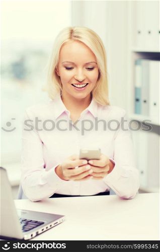 education, business, communication and technology concept - smiling businesswoman or student with smartphone texting message in office