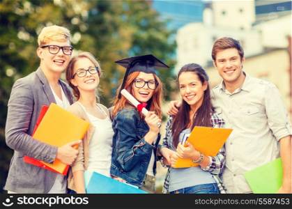 education, campus and teenage concept - group of students or teenagers with files, folders, eyeglasses and diploma