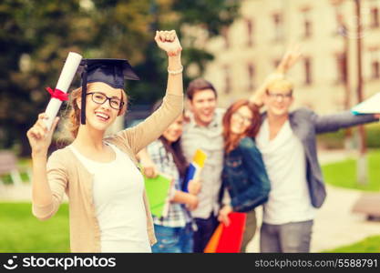 education, campus and teenage concept - smiling teenage girl in corner-cap and eyeglasses with diploma and classmates on the back