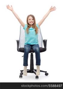 education, celebration, office and happy people concept - smiling little girl sitting in big office chair with hands up