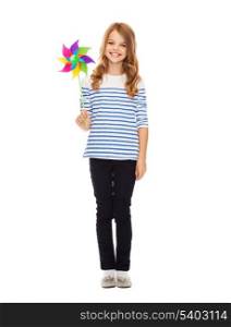 education, childhood and ecology concept - child with colorful windmill toy