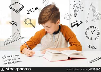 education, childhood, people, homework and school concept - student boy with book writing to notebook at home over mathematical doodles