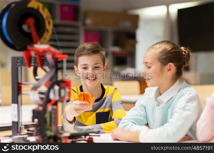 education, children, technology, science and people concept - group of happy kids with 3d printer and plastic detail prototype at robotics school lesson