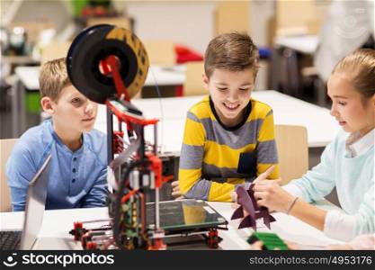 education, children, technology, science and people concept - group of happy kids with 3d printer at robotics school lesson. happy children with 3d printer at robotics school