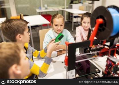education, children, technology, science and people concept - group of happy kids with 3d printer at robotics school lesson. happy children with 3d printer at robotics school