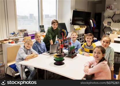 education, children, technology, science and people concept - group of happy kids with 3d printer and laptop computer at robotics school lesson. happy children with 3d printer at robotics school