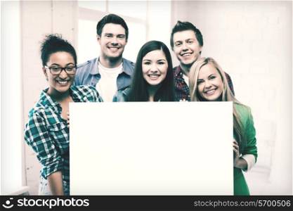 education concept - group of students at school with blank white board