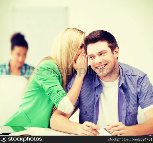 education concept - group of students gossiping at school