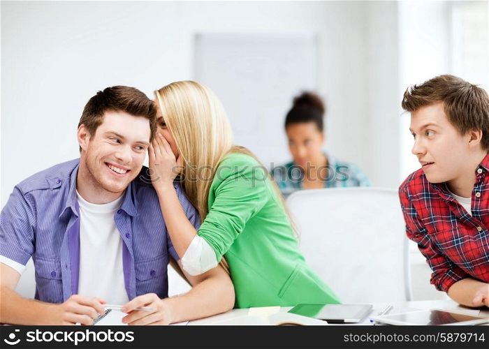education concept - group of students gossiping at school