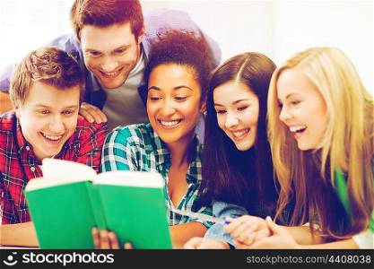 education concept - group of students reading book at school. students reading book at school