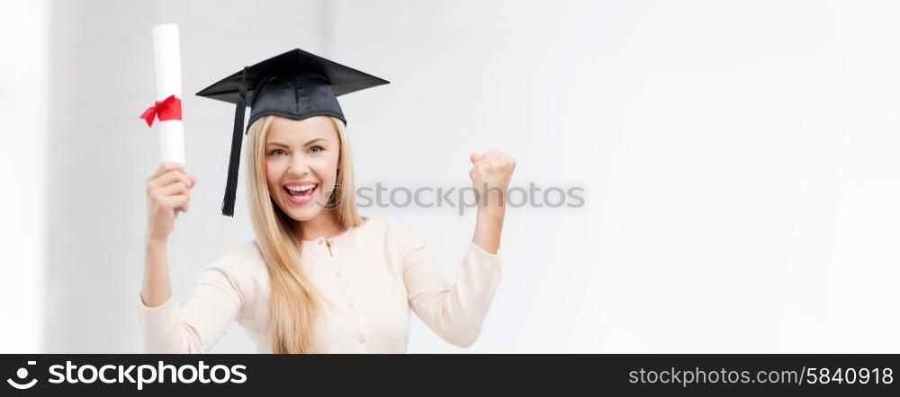 education concept - happy student in graduation cap with certificate. student in graduation cap with certificate