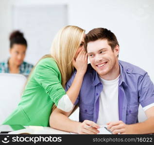 education concept - male and female students talking at school or college