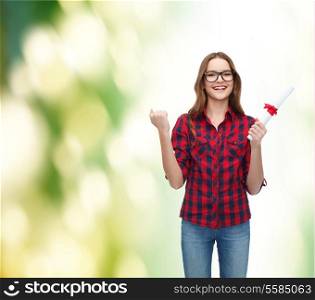 education concept - smiling female student in eyeglasses with diploma