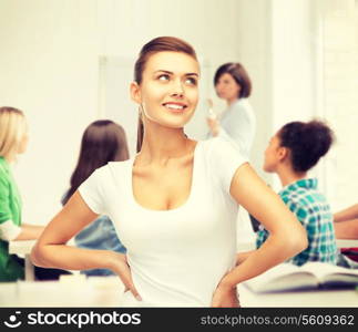 education concept - smiling student girl in blank white t-shirt at school