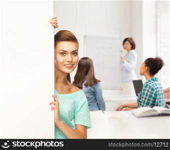 education concept - smiling student girl with white blank board