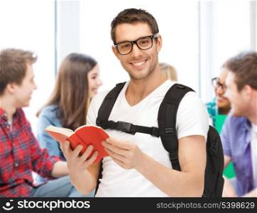 education concept - student boy reading book at school
