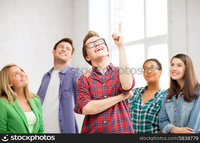 education concept - student boy with group of students at school