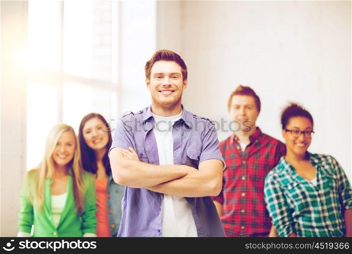 education concept - student boy with group of students at school. student boy at school
