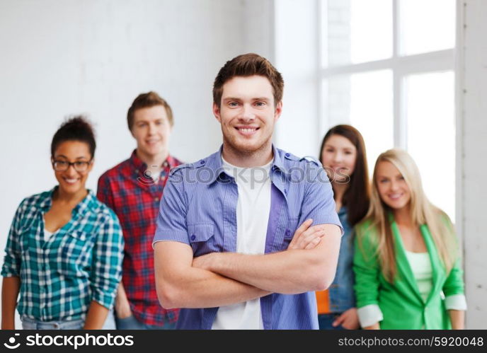 education concept - student boy with group of students at school. student boy at school