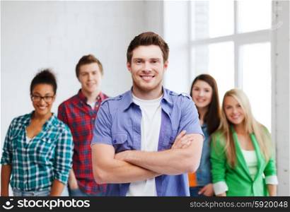 education concept - student boy with group of students at school. student boy at school