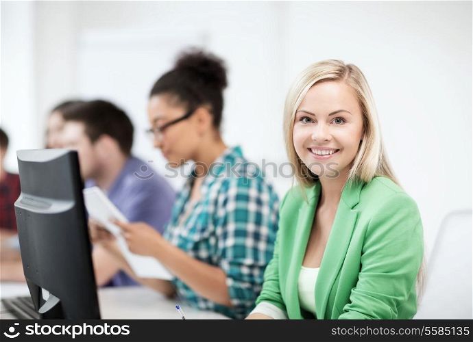 education concept - student girl with computer studying at school