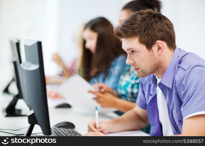 education concept - student with computer studying at school