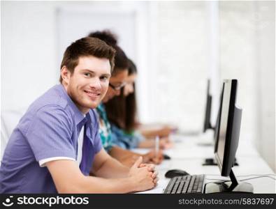 education concept - student with computer studying at school
