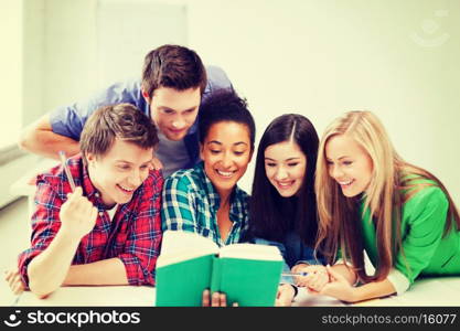 education concept - students reading book at school