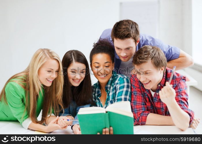 education concept - students reading book at school. students reading book at school