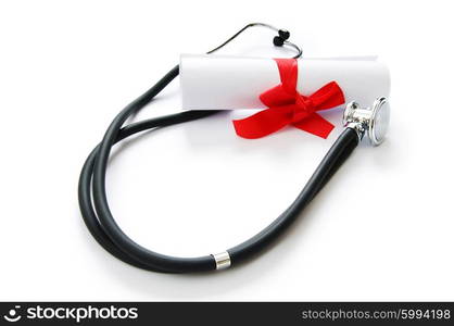 Education concept with diploma and stethoscope on white