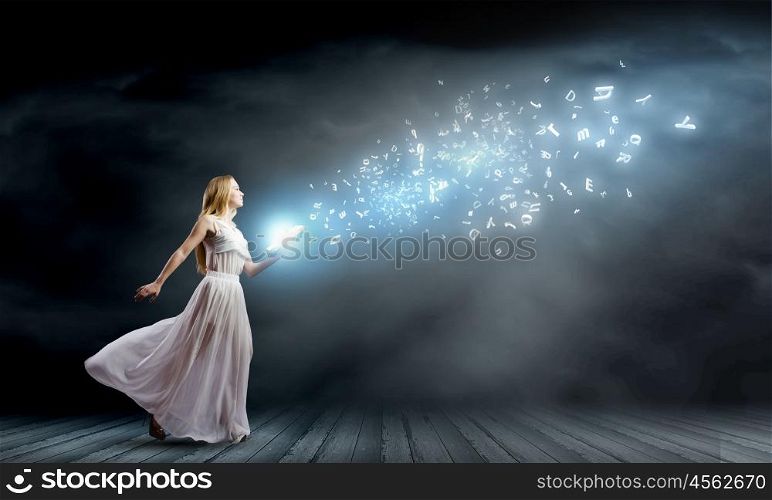 Education concept. Woman in white long dress with book in hands