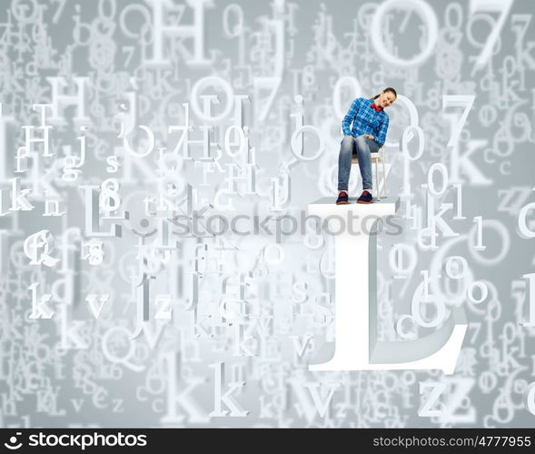 Education concept. Young girl sitting on huge white letter