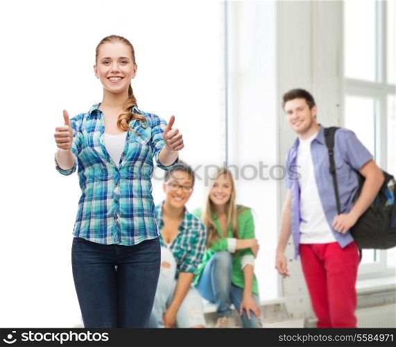 education concept - young woman in casual clothes showing thumbs up