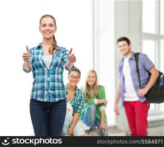 education concept - young woman in casual clothes showing thumbs up