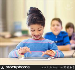 education, elementary school, technology and children concept - happy little student girl with tablet pc over classroom and classmates background