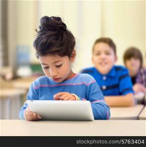 education, elementary school, technology and children concept - little student girl with tablet pc over classroom and classmates background