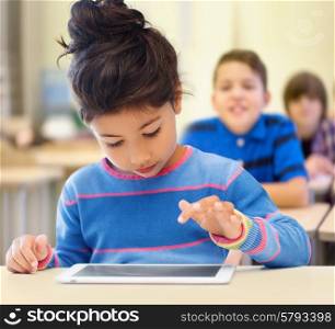 education, elementary school, technology and children concept - little student girl with tablet pc over classroom and classmates background