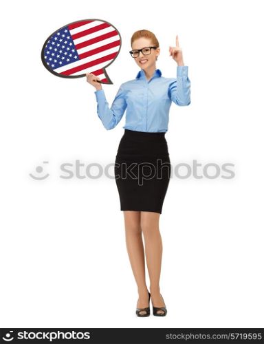 education, foreign language, english, people and communication concept - smiling woman holding text bubble of american flag and pointing finger up