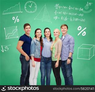 education, friendship and people concept - group of smiling students standing over green board