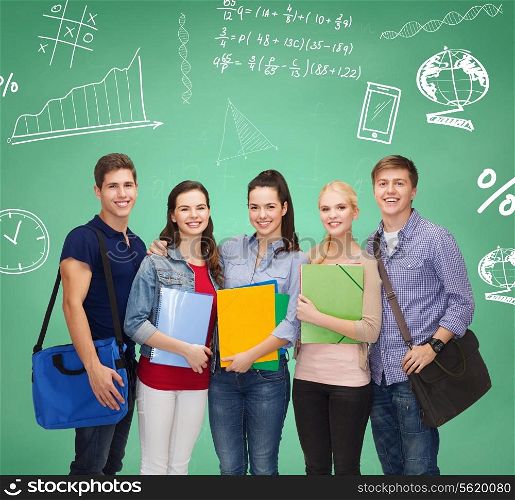 education, friendship and people concept - group of smiling students with folders and bags over green board