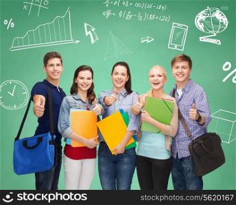 education, friendship and people concept - group of smiling students with folders and bags showing thumbs up over green board