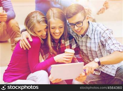 education, friendship, technology, drinks and people concept - group of smiling students with tablet pc computer and paper coffee cup taking selfie or video