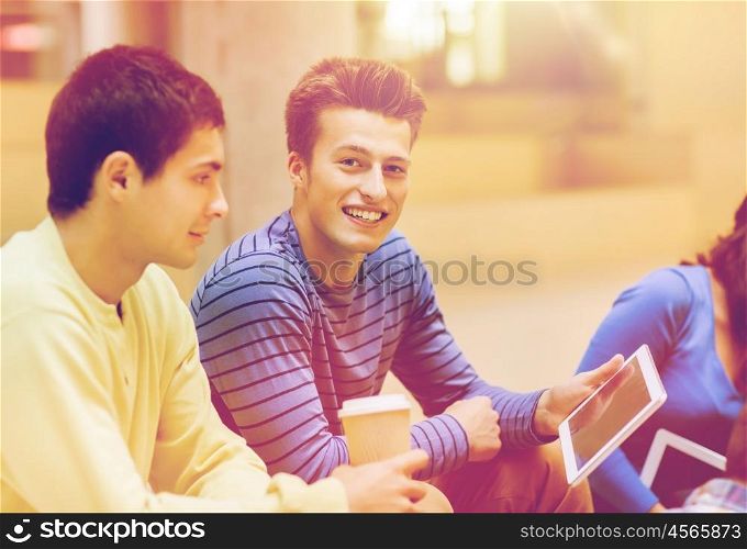 education, friendship, technology, drinks and people concept - group of smiling students with tablet pc computers and paper coffee cup