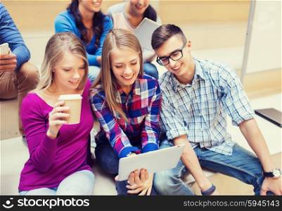 education, friendship, technology, drinks and people concept - group of smiling students with tablet pc computers and paper coffee cup