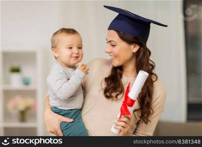 education, graduation and motherhood concept - happy mother student with baby boy and diploma at home. mother student with baby boy and diploma at home