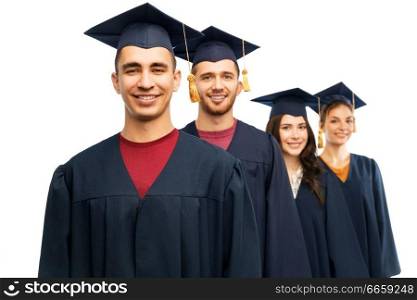 education, graduation and people concept - group of happy graduate students in mortar boards and bachelor gowns over white background. graduates in mortar boards and bachelor gowns